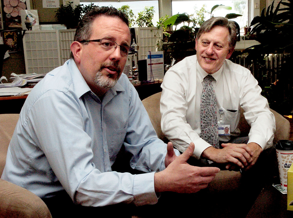 Messallonskee Middle School Principal Mark Hatch, left, and Regional School Unit 18 Superintendent Gary Smith last week speak about a new teacher evaluation system in the district.