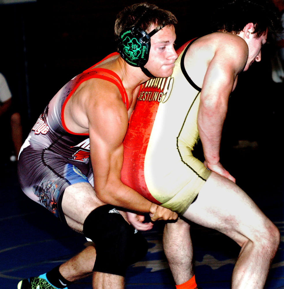 Nebraska's Jeff Wheelock, left, wrestles Maine's Caleb Austin on Monday night at Mountain Valley High School in Rumford. The 35th annual Maine-Nebraska wrestling exchange is this week, with matches scheduled in Rumford, Belfast and Skowhegan.