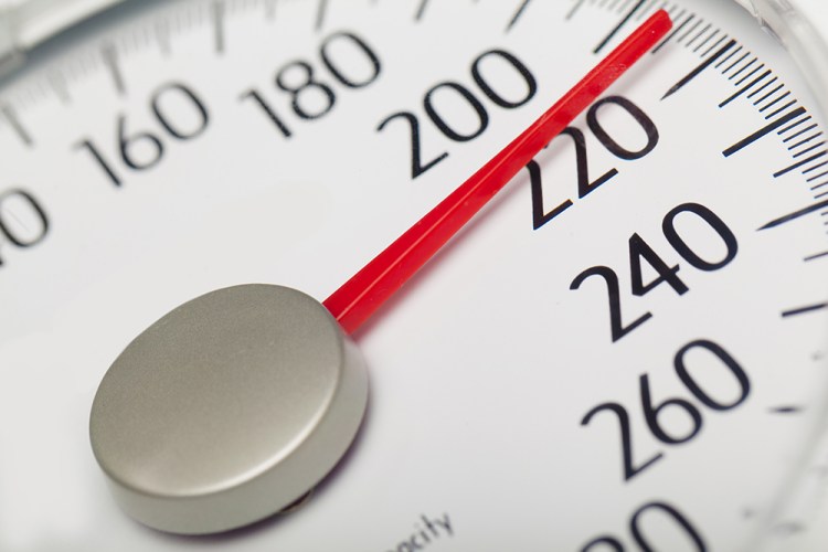 A person who is 5 foot 4, the average height for U.S. women, is considered obese at a weight of 174 pounds or more. A person who is 5 foot 9, about the average height for men, is deemed obese at 203 pounds. Shutterstock image