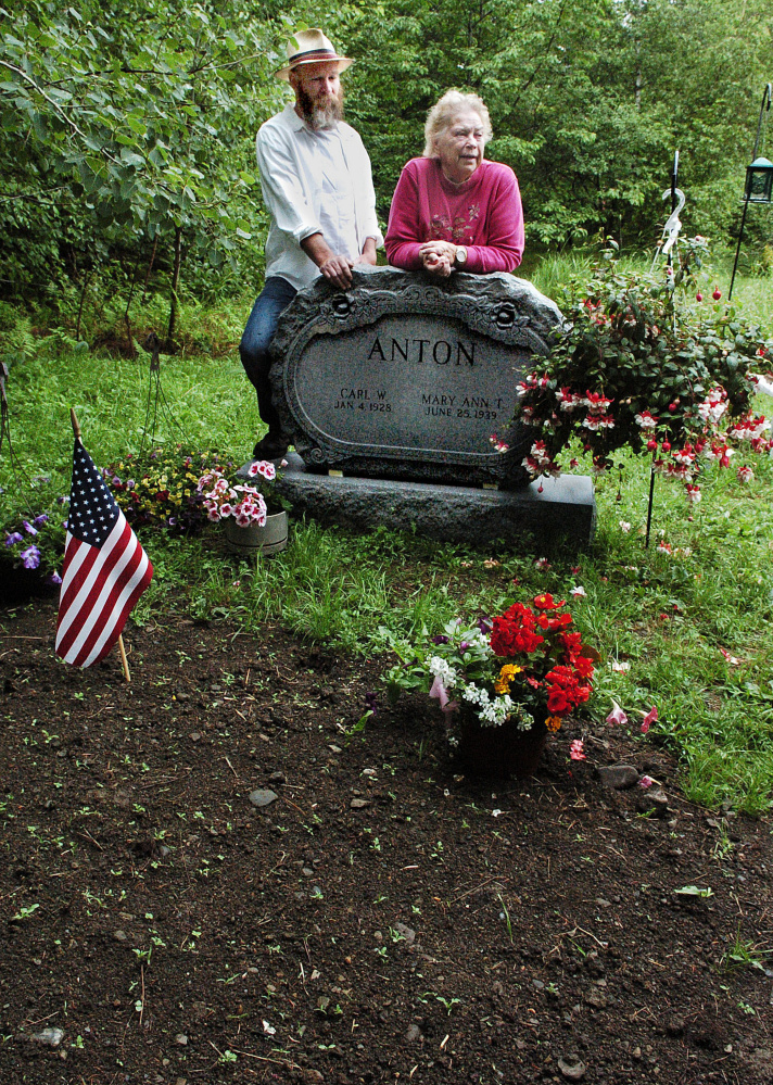 Scott Anton and his mother, Mary Ann, speak about her husband, Carl, who died last month and is buried on their property in West Athens.