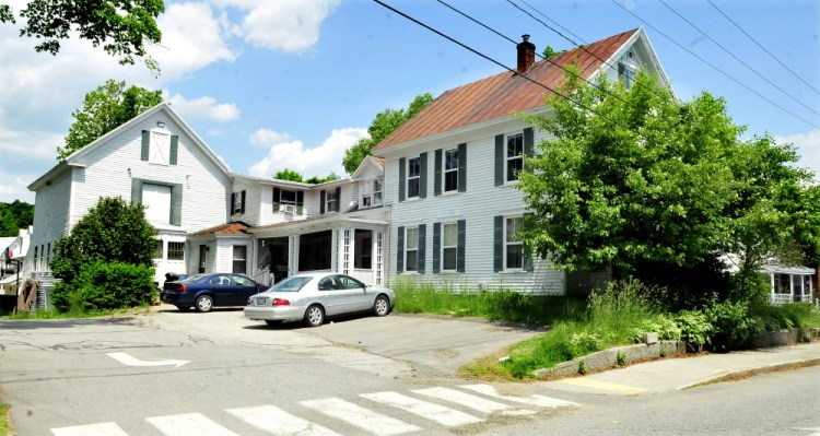 The apartment building at 112 Church St. in Farmington will be torn down this week and replaced with a parking lot.