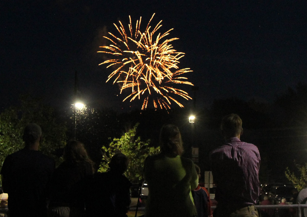 Winslow's Fourth of July fireworks explode over the Kennebec River as seen from the Hathaway Creative Center in Waterville earlier this month. Town Manager Mike Heavener told the Town Council Monday night that overflow crowds from the fireworks display spilled onto the U.S. Route 201 bridge, forcing it to be closed down.