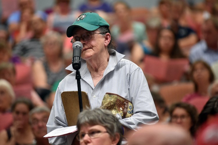 Elaine Graham asks for clarification of Article 7 of the Regional School Unit 9 budget during a districtwide meeting Thursday at Mt. Blue High School in Farmington.