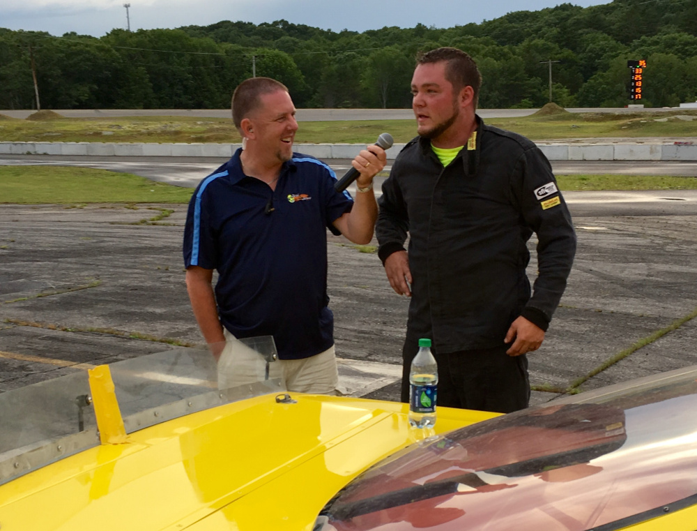 Staff photo by Travis Barrett 
 Josh St. Clair of Liberty, right, talks to Wiscasset Speedway track announcer Ken Minott after winning the Late Model feature Saturday night.