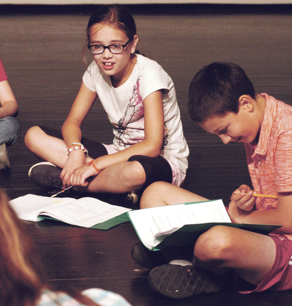 Olivia Tompkins and Cyrus Engle read a script last week during a Farmington Children's Summer Theater Camp rehearsal in Farmington.