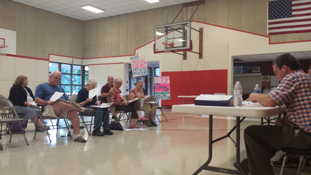 Residents state their concerns about proposed changes to China's land development code Tuesday night during a public hearing held by the Planning Board at China Middle School.