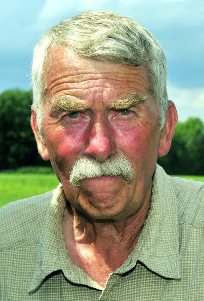 Eric Elvin cuts mulch hay on Thursday at his family's farm in Readfield. Elvin said that they got a good first crop of hay earlier this summer. But it has been so dry that fields haven't been growing in very well, so they might not get a second crop.