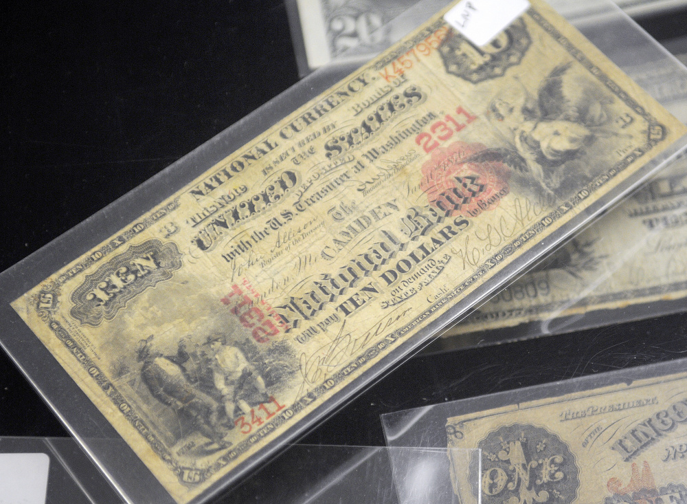 A 19th-century $10 bill issued by Camden National Bank, from the collection of Frank Trask, on Sunday at the Capital City Coin Show, held at the Elks Lodge in Augusta.