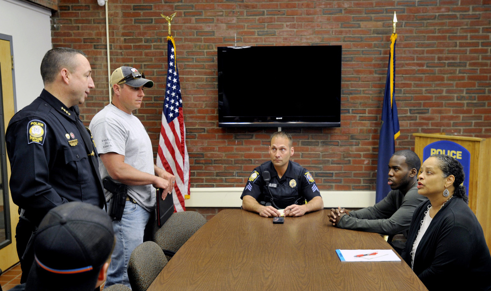 Portland Police Chief Michael Sauschuck and other officers meet Friday with David Thete of the group Kesho Wazo and Rachel Talbot Ross, the longtime president of the Portland branch of the NAACP. Thete and his group led a vigil Friday night.