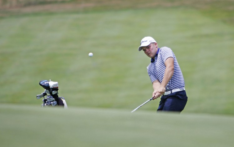 Matt Hutchins of Falmouth chips onto the 16th green Thursday during the final round of the Maine Amateur golf tournament at York Golf & Tennis Club. Hutchins, 19, shot a 5-under 65 and won the tournament by six strokes.