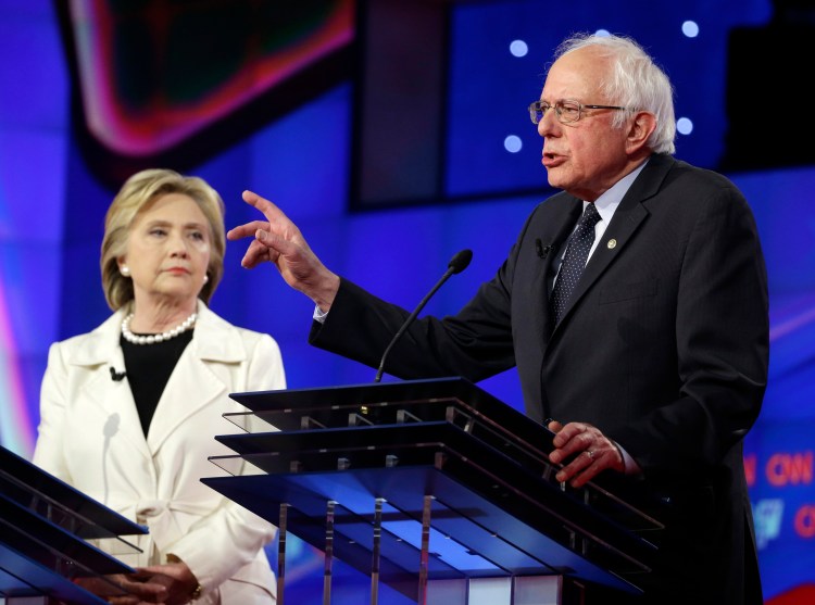 Sen. Bernie Sanders speaks as Hillary Clinton listens during the CNN Democratic Presidential Primary Debate on April 14, 2016. Seth Wenig/Associated Press