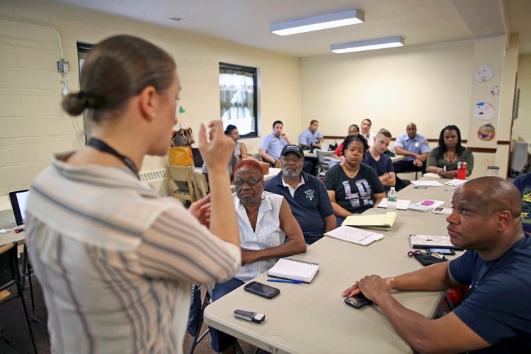 Dr. Zoe Maher, a Temple trauma surgeon, explains the Philadelphia Immediate Transport in Penetrating Trauma Trial to community leaders, at the Hunting Park Community Center, in Philadelphia. Joseph Kaczmarek/Associated Press