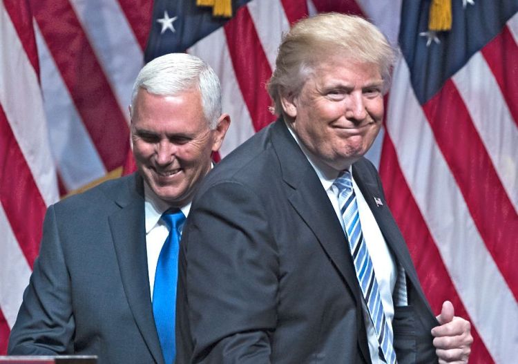 Republican presidential candidate Donald Trump introduces Gov. Mike Pence, R-Ind., during a campaign event Saturday in New York. Evan Vucci/Associated Press