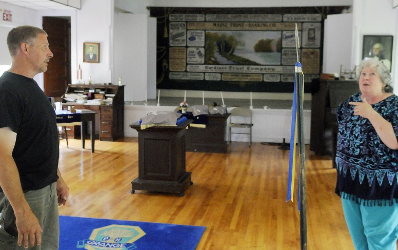 Dana and Debbie Rogers talk about plans for growth Tuesday at the Arlington Grange in Whitefield, where improvements are continuing to be made the Grange hall.