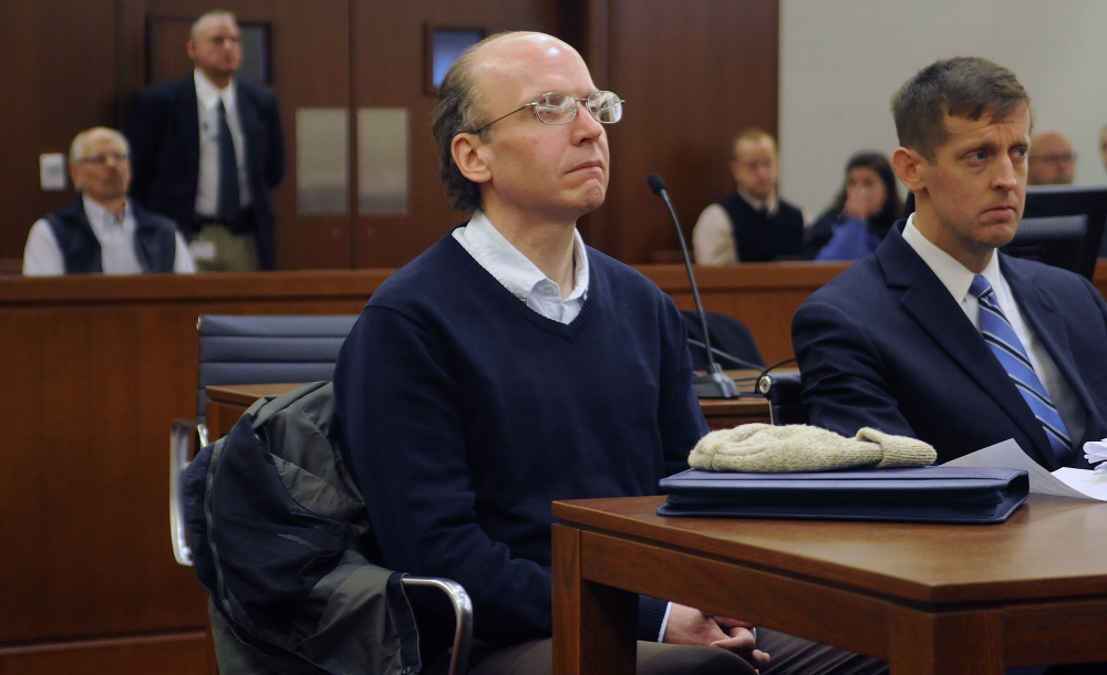 Christopher Knight, center, sits silently March 23, 2015, during his graduation from the Co-Occurring Disorders Court in Augusta. Known as the "North Pond Hermit," Knight spent seven months in jail, followed by 17 months in the special court program.