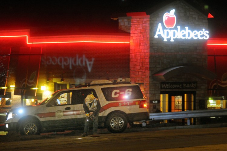 A utility worker searches for a natural gas pipeline Feb. 17 on Western Avenue in Augusta after the Fire Department responded to a leak at Shaw's Plaza. On Tuesday, Summit Natural Gas of Maine agreed to pay fines associated with that leak and other safety violations.