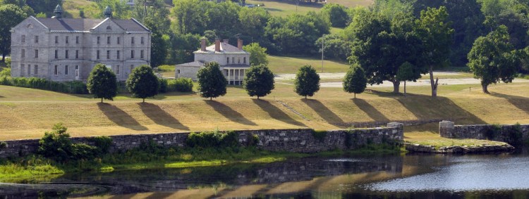 The hillside leading down to granite dock below the Kennebec Arsenal in Augusta shows evidence of recent mowing Friday.