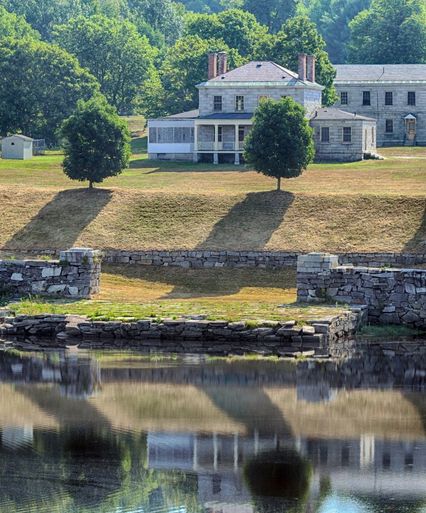 The hillside leading down to granite dock below the Kennebec Arsenal in Augusta shows evidence of recent mowing Friday.