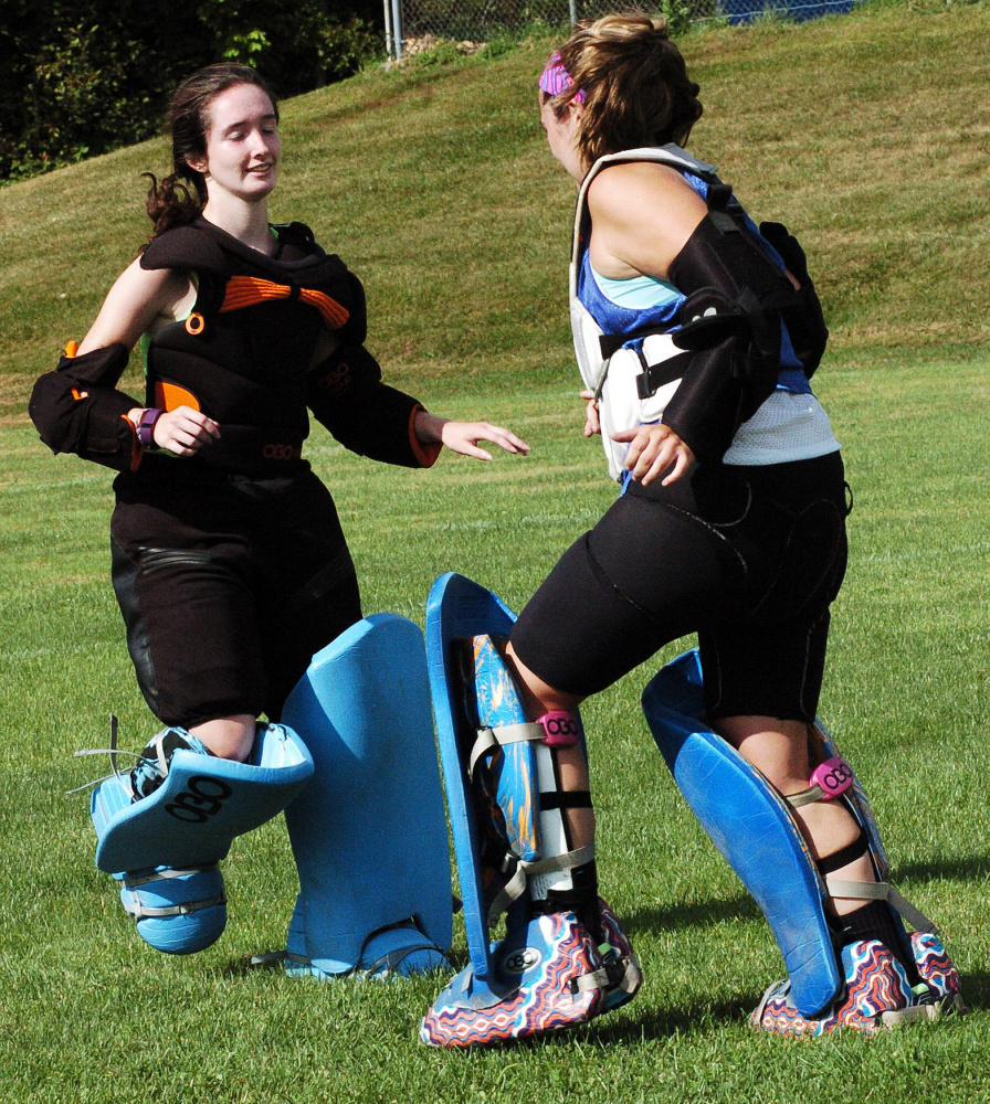 Messalonskee field hockey goalies Hannah Pinney, left, and Julie Vigue go through drills during practice last season.