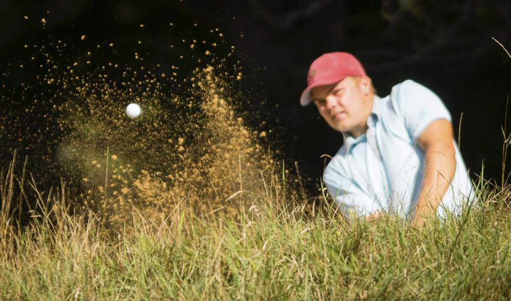 Matt Hutchins chips the ball from the bunker during the Maine Match Play championship on Thursday at the Brunswick Golf Club.