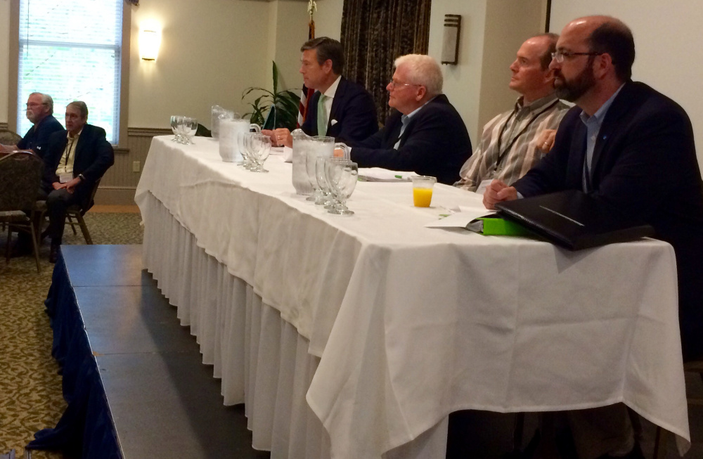 Matt Erskine, U.S. deputy assistant secretary of commerce for economic development; Patrick Strauch, executive director of the Maine Forest Products Council; Steve Schley, president of Pingree Associates; and Yellow Light Breen, president and CEO of the Maine Development Foundation, answer questions at the start of Wednesday's EDAT tour at the University of Maine. They are involved with the federal team that is in Maine this week gathering information on the challenges and assets of the state's forest products industry.