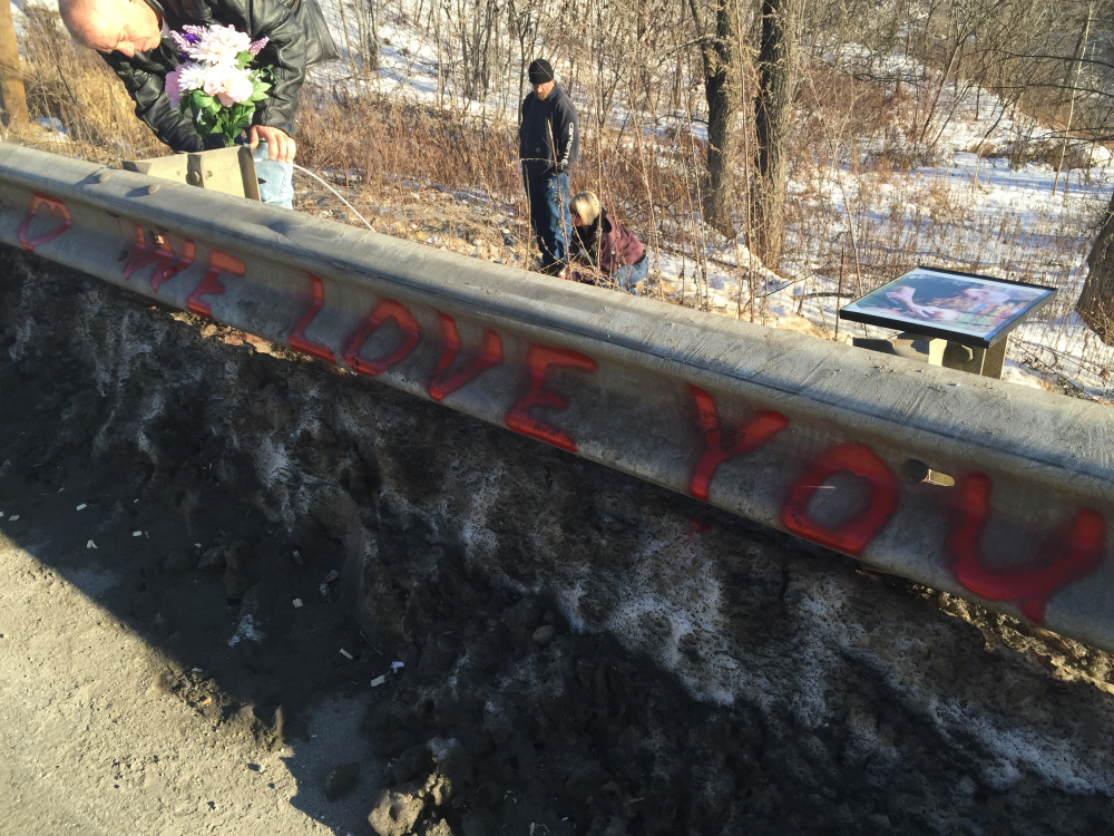 Ricky Gaboury secures flowers to a memorial where his daughter Taylor Gaboury was struck and killed by Tommy Clark, of Industry, Jan. 1. Nikita Tolman, of Kingfield, Clark's girlfriend, was indicted on charges of hindering apprehension or prosecution and false public report for her alleged part in Gaboury's death. Clark pleaded guilty to aggravated operating under the influence and leaving the scene of an accident in June.