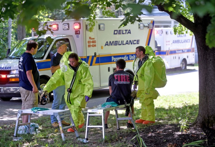 Waterville firefighters and other emergency personnel respond to a report of a chemical spill Thursday at a multi-family apartment building at 270 Main St. in Waterville. The call turned out to be over-use of a bug repellent containing diatomaceous earth.