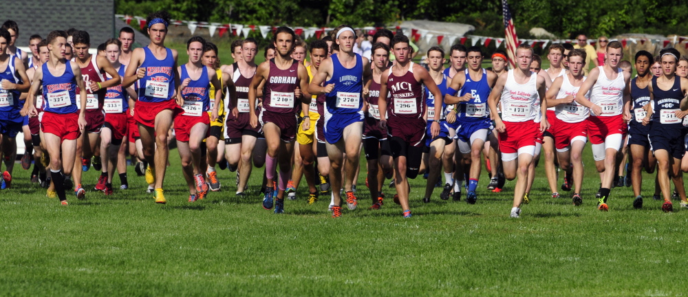 Boys and girls runners from across the state take off across the Cony High School practice football field at the start of the Laliberte Invitational last year.