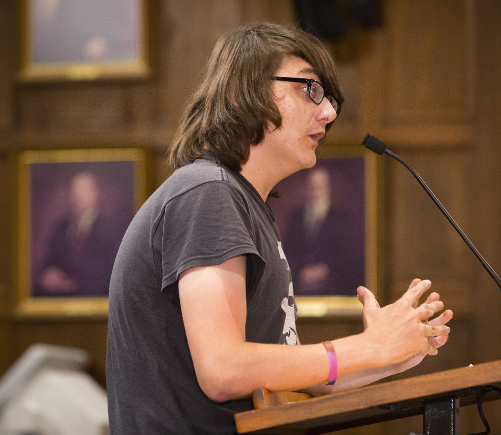 Matt Raymond of Portland speaks to the City Council on Monday night, accusing the police department of brutality in the arrests of 18 protesters in the Old Port on the night of July 15. "Police brutality does in fact occur. We witnessed that," he said.