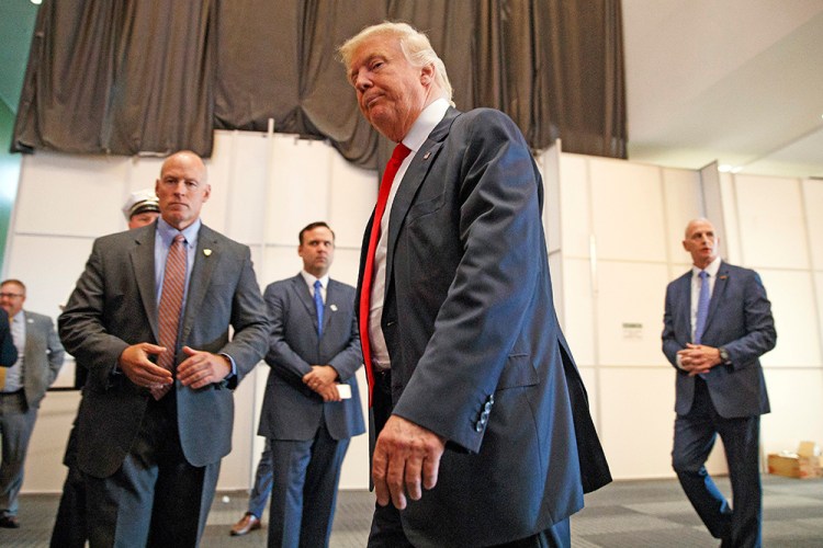 Republican presidential candidate Donald Trump walks away after speaking to reporters before a town hall event Monday in Columbus, Ohio. Evan Vucci/Associated Press