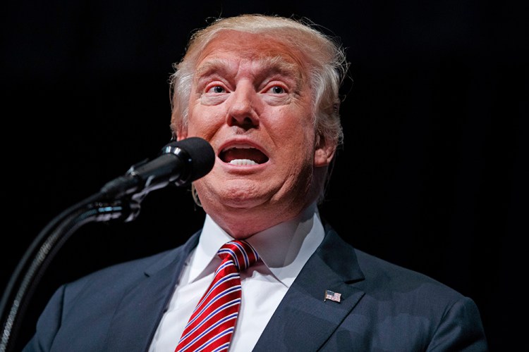 Republican presidential candidate Donald Trump speaks during a campaign rally in Ashburn, Va., Tuesday. During the rally a veteran gave Trump his Purple Heart medal as a show of support for the candidate. Trump responded: "I always wanted to get the Purple Heart. This was much easier." Evan Vucci/Associated Press