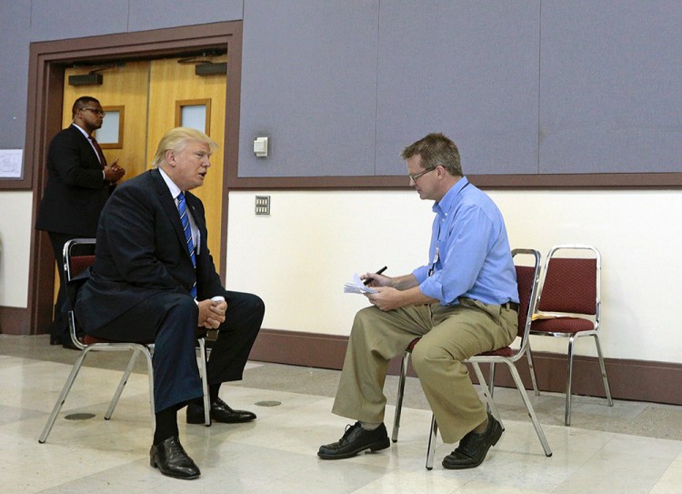 Press Herald Staff Writer Scott Thistle interviews Republican presidential candidate Donald Trump before his rally Thursday at Merrill Auditorium in Portland. 