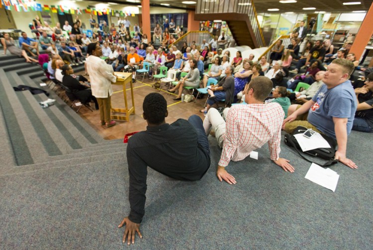 About 150 people attended Thursday night's forum at the Reiche elementary school, where panelists told the audience that it can be challenging to be a black person living in a predominately white state.