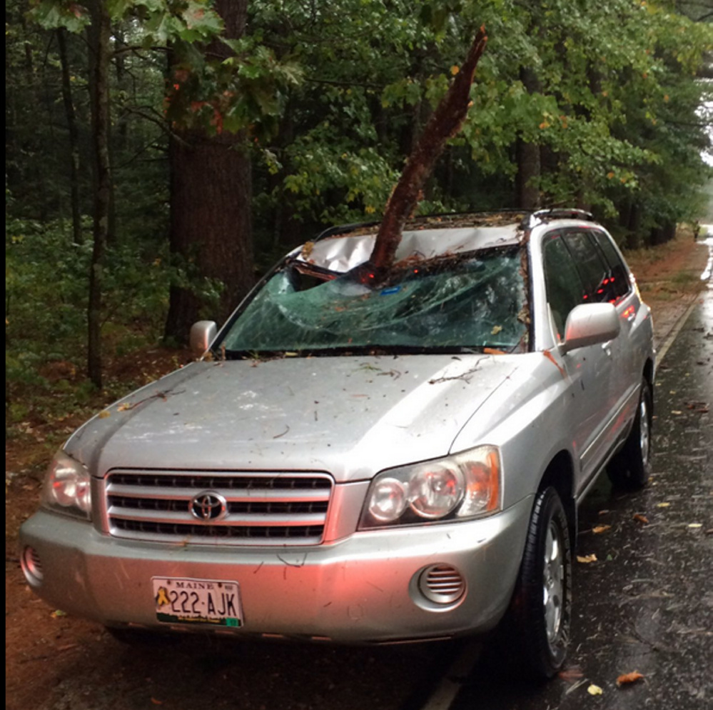 A car shows damage from Sunday's storm.