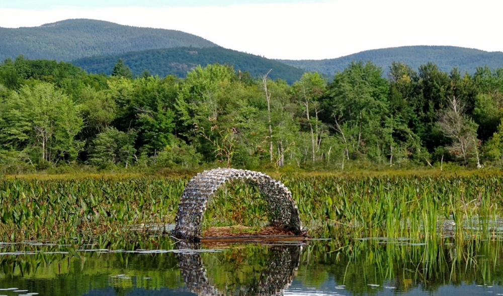 A loon nesting platform,  used to reduce nest failures from predation or water-level fluctuations, floats in the water at Kezar Lake.