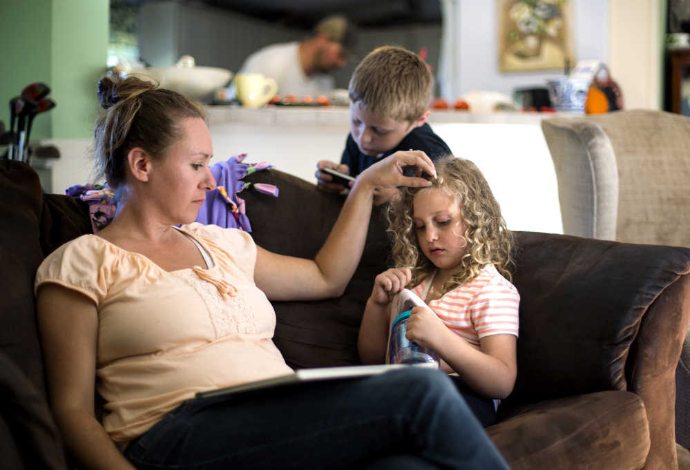 Recreational growers "aren't focused on what a specialty patient like Kaylee needs," says Samantha Brown, in her South Berwick home last week with her son Dylan, 8, and daughter Kaylee, 5. Her daughter depends on cannabis oil to control a seizure disorder. Brown worries the move to legalize pot could limit access to medication, especially for patients under 21.