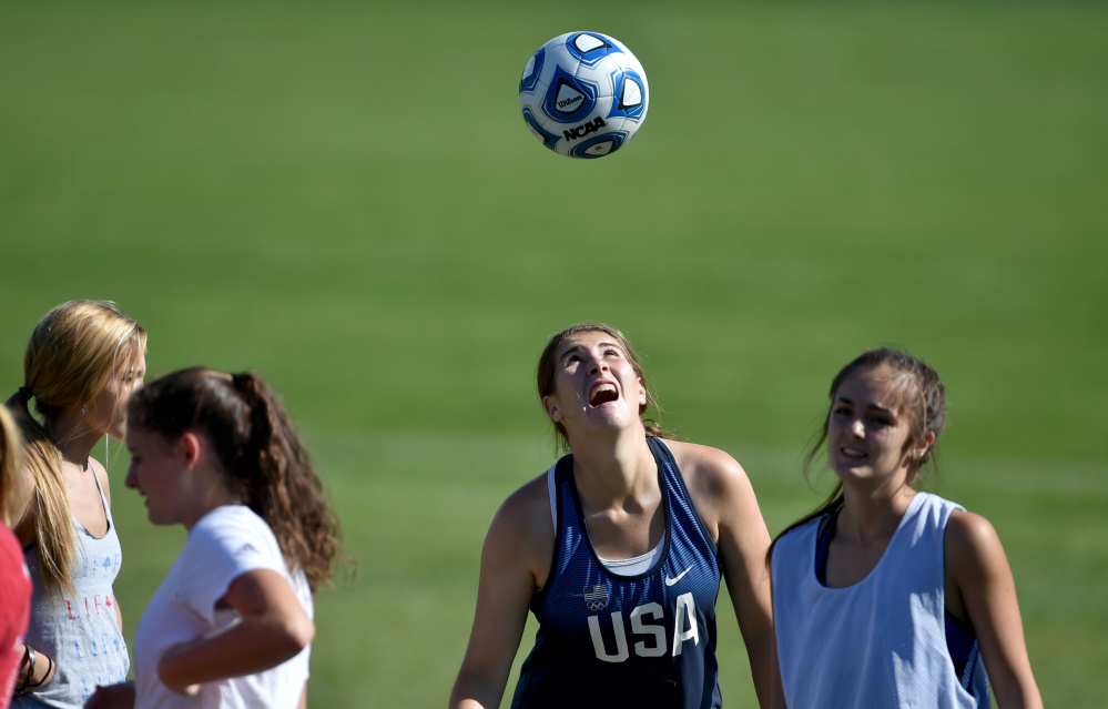 McKenna Brodeur works out with her teammates during practice Thursday at Messalonskee High School in Oakland.