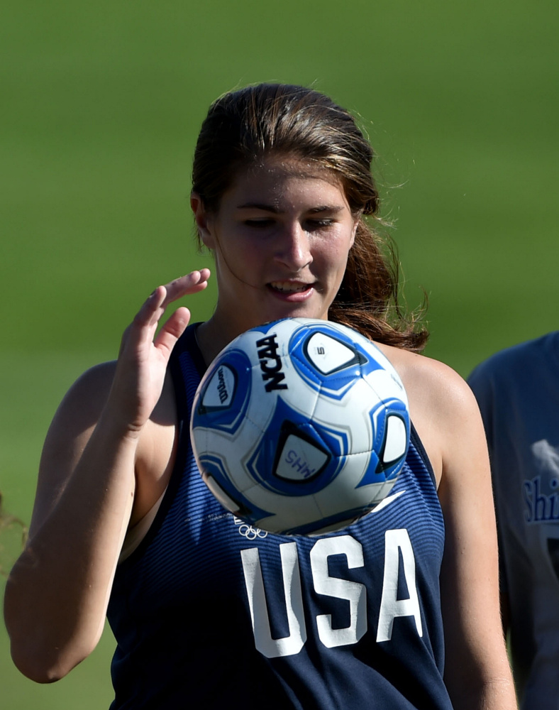 McKenna Brodeur works out with her teammates during practice Thursday at Messalonskee High School in Oakland.