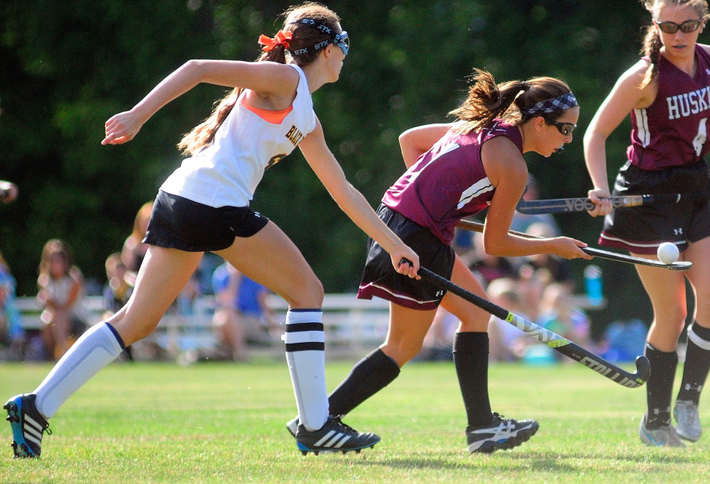 Maranacook junior Olivia Tamborini, left, and MCI sophomore Madisyn Hartley compete for possession during a game Thursday in Readfield.