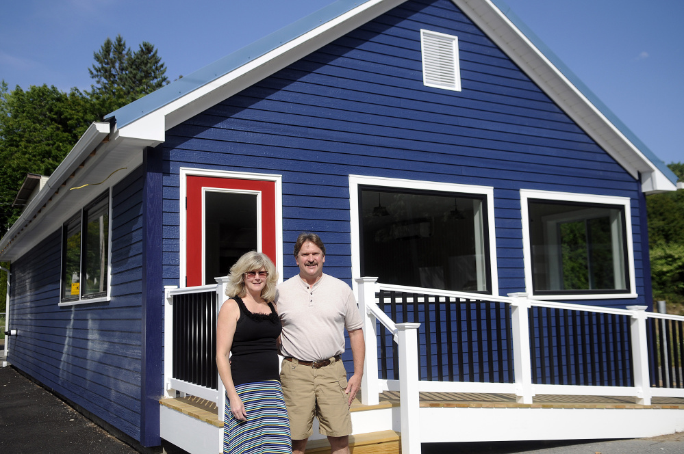 Dave Poulin and Lisa Taber Poulin outside the former Al's Pizza in Augusta on Thursday. The couple will open a cafe at the site called Fat Cat's Cafe.