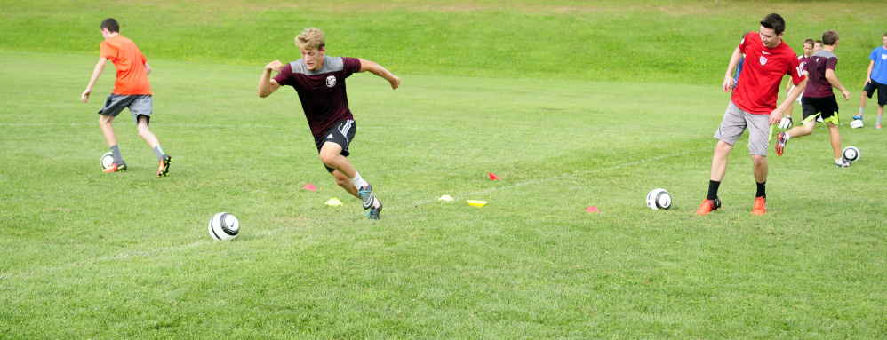 Members of the Monmouth boys soccer team run during an Aug. 16 practice  in Monmouth. The Mustangs return a talented team that once again should challenge for the Class C South title.