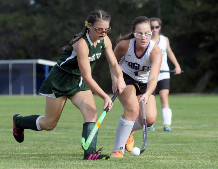 Mount View sophomore Rachelle Ravin, left, and Erskine Academy sophomore Olivia Kunesh battle for a ball during a game Thursday in South China.