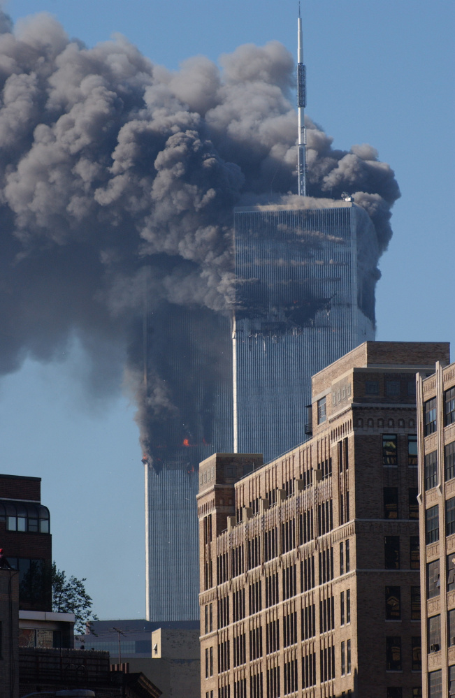 The south tower of the World Trade Center's twin towers begins to collapse after a hijacked plane crashed into it on September 11, 2001 in New York City.(AP Photo/Louis Lanzano)