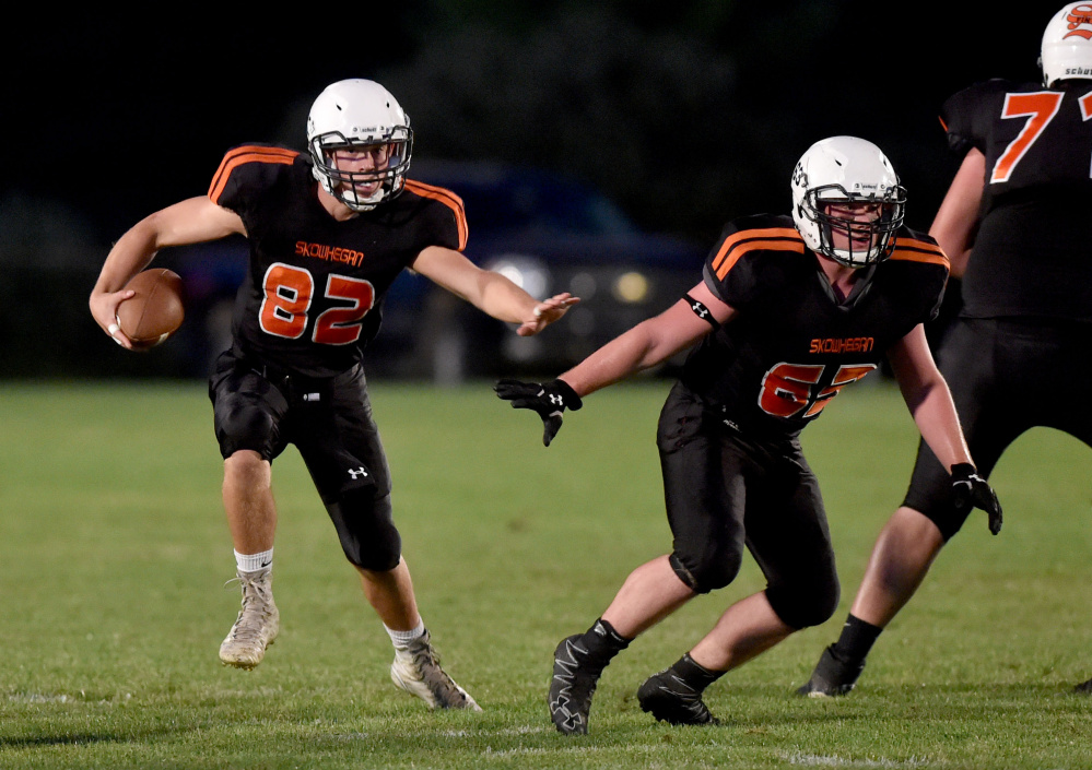 Skowhegan quarterback Garrett McSweeney (82) rushes for some yards against Gardiner in a PTC B game on Sept. 9 in Skowhegan.