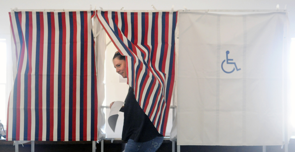Lianna Davis votes Wednesday in Litchfield on the Regional School Unit 4 budget.