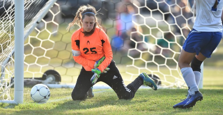 Madison Area Memorial High School's Sydney LeBlanc (7) scores off the rebound of a save by Oak Hill High School goalie Anna Dodge (25) in Madison on Thursday.