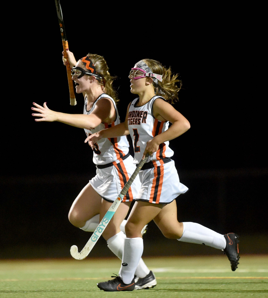 Gardiner's Hailee Lovely, left, celebrates her goal with teammate Haley Brann (2) against Winslow on Tuesday at Thomas College in Waterville.