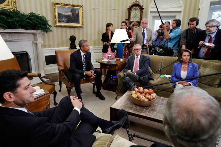 Speaker of the House Paul Ryan, R-Wis., left front, listens next to Senate Majority Leader Mitch McConnell, R-Ky., as President Barack Obama speaks next to Senate Democratic Leader Harry Reid, of Nevada, and House Democratic Leader Nancy Pelosi, of Calif., in the Oval Office of the White House Monday.