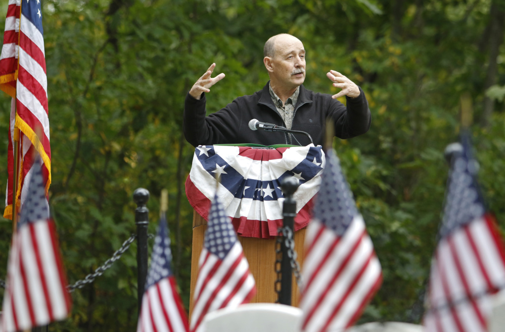 Larry Glatz of Portland, a retired teacher and historian, speaks at the ceremony honoring War of 1812 veteran William Blake. The war "has almost vanished from our memories," he said.