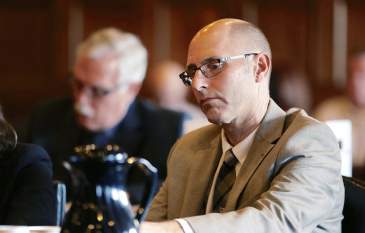 At the Cumberland County Courthouse on Monday, landlord Gregory Nisbet listens as prosecutor John Alsop details the deaths of tenants in a fire at an apartment house at 20-24 Noyes Street in Portland owned by Nisbet.